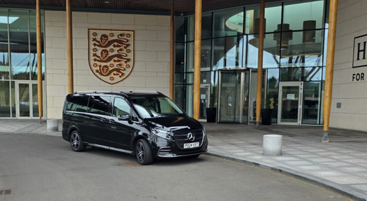 Black Mercedes V-Class people carrier outside the Hilton at St George's Park
